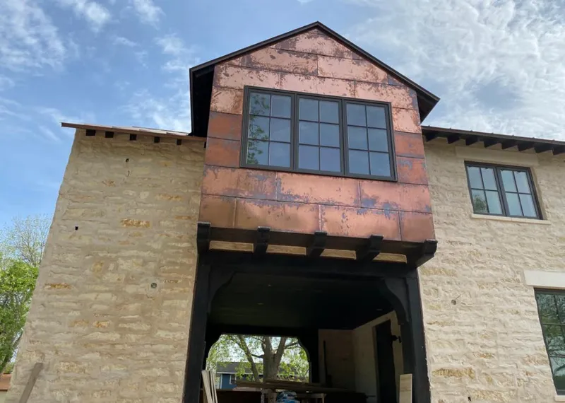 Copper metal panel facade on a stone building for Metal Roof Coating in Alachua